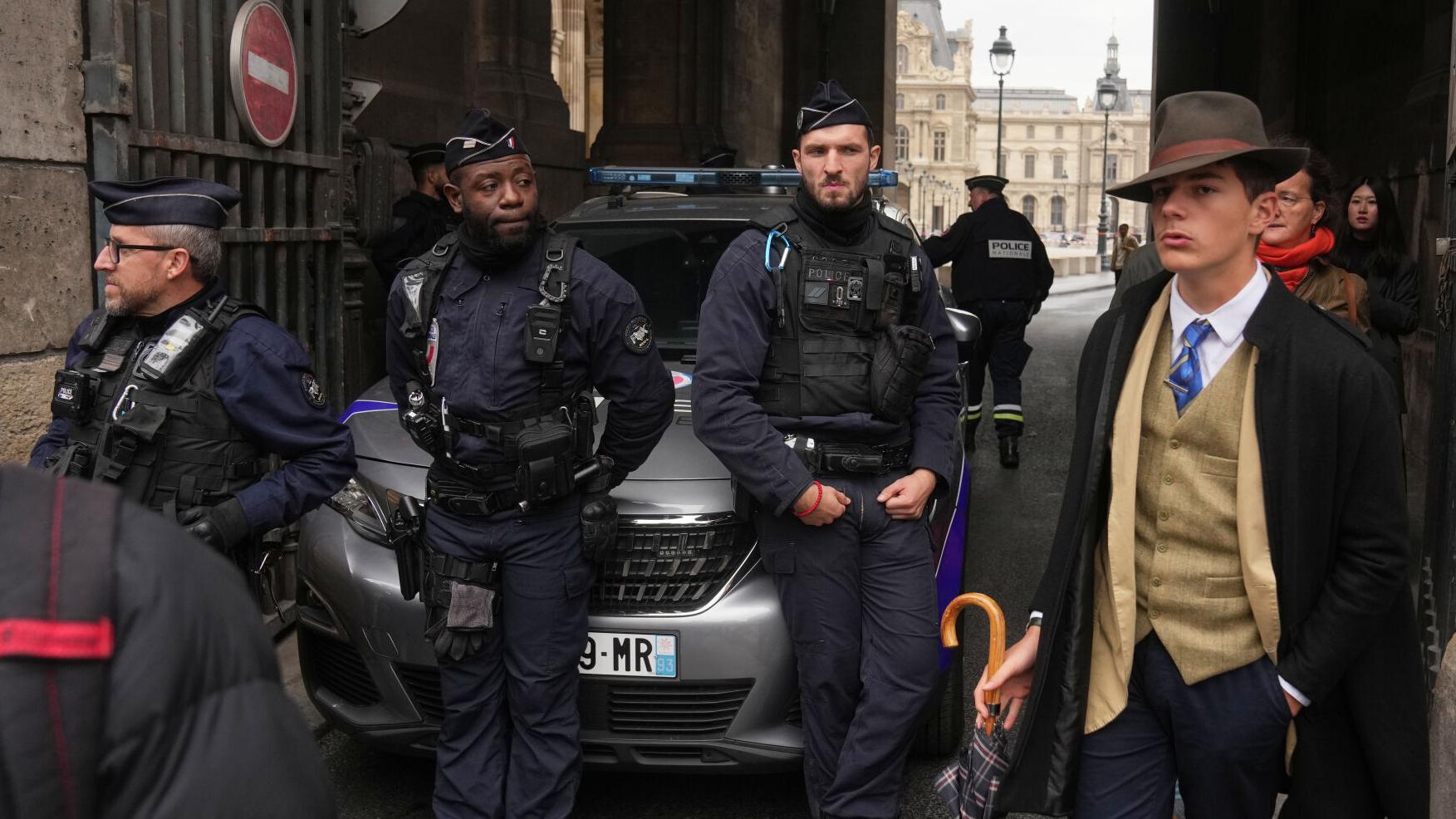Inspector Clouseau? The mystery man in AP photo after Louvre jewel heist creates a buzz